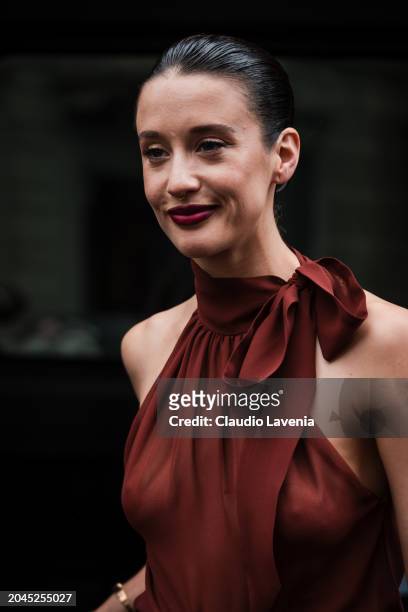 Maria Pedraza wears burnt orange top, outside Philosophy, during the Milan Fashion Week - Womenswear Fall/Winter 2024-2025 on February 23, 2024 in...