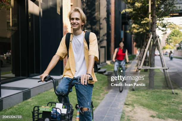 cycling on the street! - city life authentic stock pictures, royalty-free photos & images