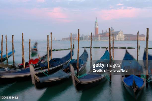 gondolas of venice at sunset - simonbradfield stock pictures, royalty-free photos & images