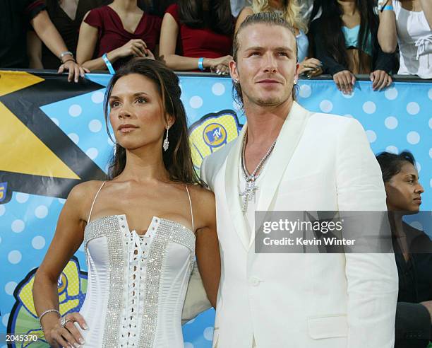 Victoria and David Beckham attend The 2003 MTV Movie Awards held at the Shrine Auditorium on May 31, 2003 in Los Angeles, California.