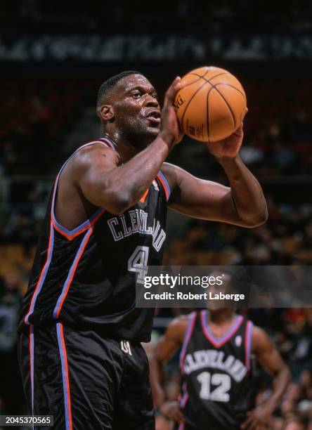 Shawn Kemp, Power Forward and Center for the Cleveland Cavaliers prepares to shoot a free throw during the NBA Central Division basketball game...