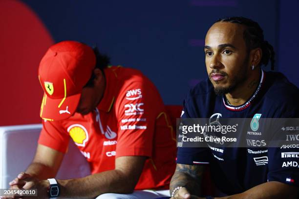 Carlos Sainz of Spain and Ferrari and Lewis Hamilton of Great Britain and Mercedes attend the Drivers Press Conference during previews ahead of the...