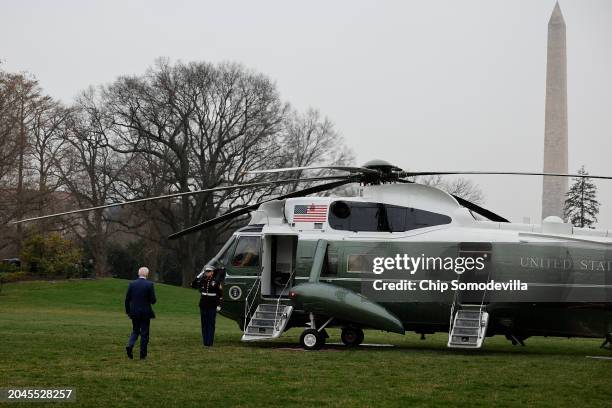 President Joe Biden walks across the South Lawn before boarding the Marine One presidential helicopter to depart the White House on February 28, 2024...