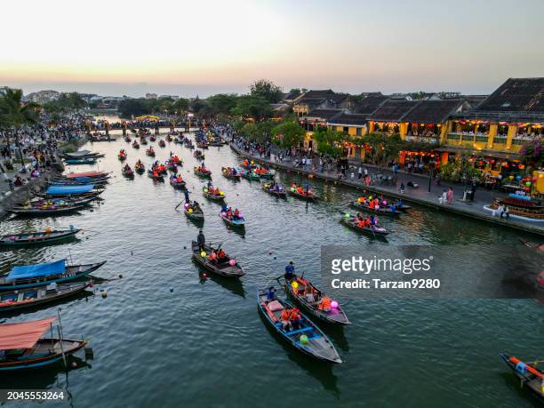 the lantern boats floating on the thu bun river at dusk time, hoi an, vietnam - urban tarzan stock pictures, royalty-free photos & images