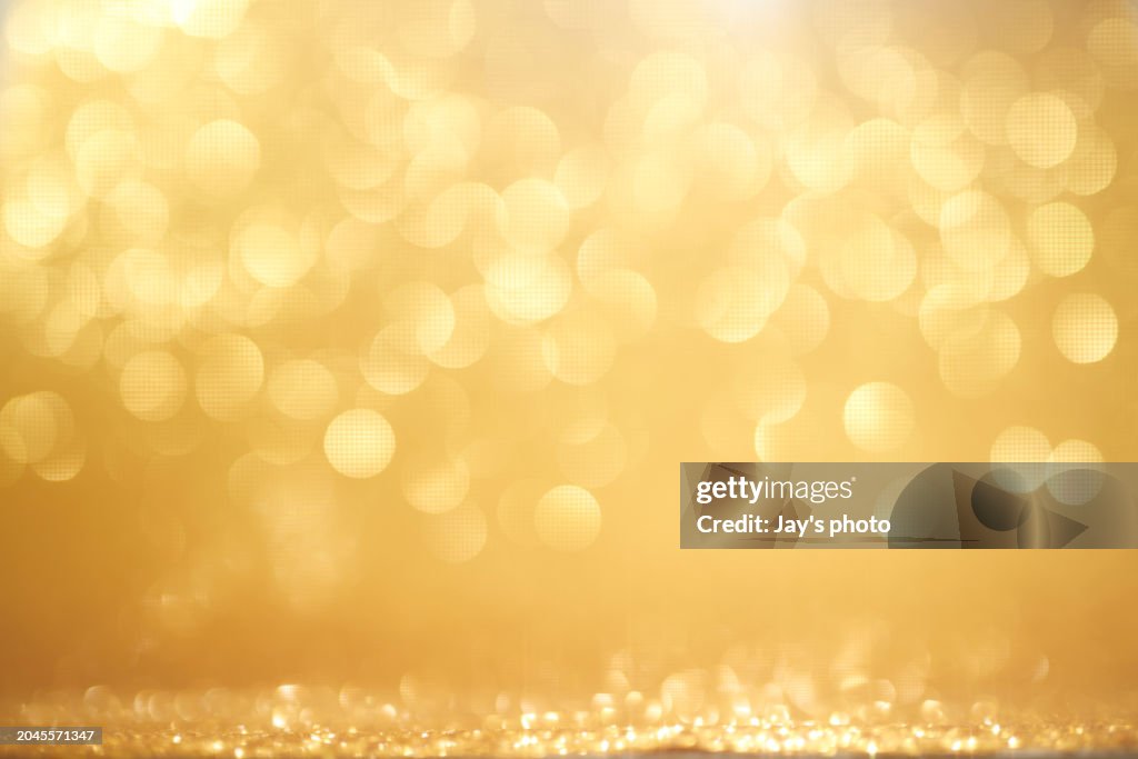 Abstract blur glowing golden color panoramic background.