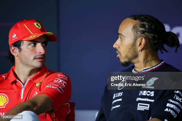 Carlos Sainz of Spain and Scuderia Ferrari interacts with Lewis Hamilton of Great Britain and Mercedes during previews ahead of the F1 Grand Prix of...