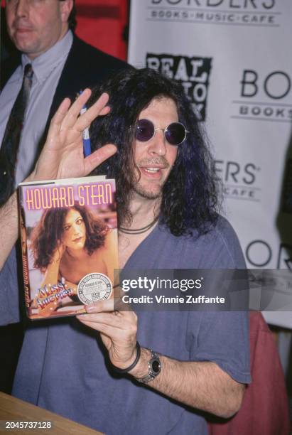 American radio host and 'shock jock' Howard Stern, wearing a blue polo shirt and sunglasses, attends a signing session for his book 'Miss America',...