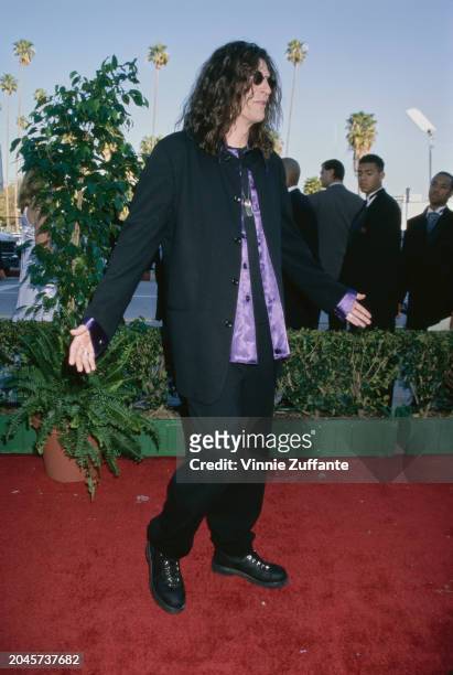 American radio host and 'shock jock' Howard Stern, wearing a black suit over a purple shirt, during the 4th Blockbuster Entertainment Awards, held at...