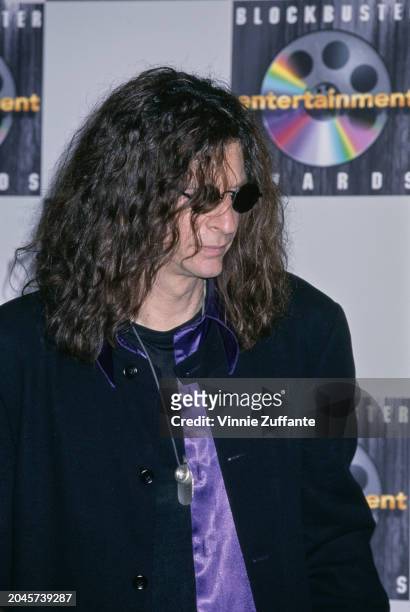 American radio host and 'shock jock' Howard Stern, wearing a black suit over a purple shirt, in the 4th Blockbuster Entertainment Awards press room,...
