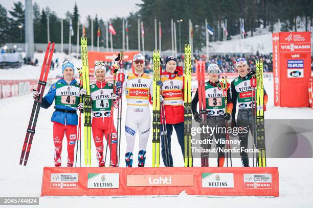 Stefan Rettenegger of Austria takes second place, Johannes Lamparter of Austria takes second place, Joergen Graabak of Norway takes first place, Jens...