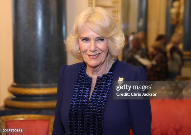 Queen Camilla smiles during a reception for the BBC's 500 Words Finalists at Buckingham Palace on February 28, 2024 in London, England.