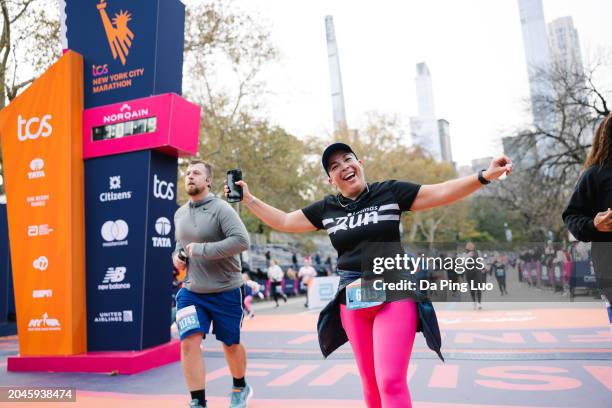 Runners cross the finish line at The TCS New York City Marathon Abbott Dash to the Finish 5K course goes from the United Nations to the marathon...