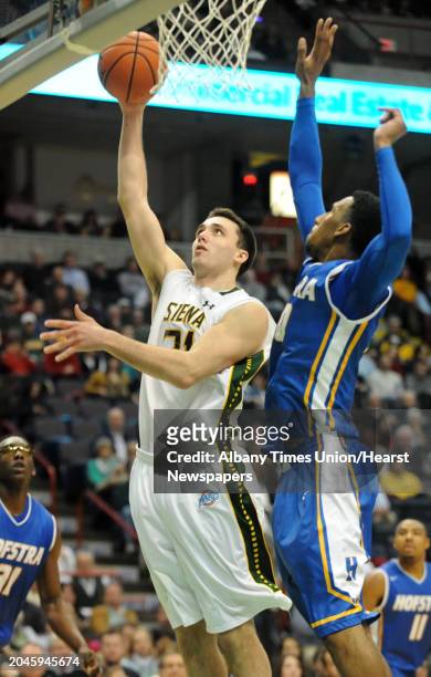 Siena's Brett Bisping goes up for a layup against Hofstra's Jamall Robinson during a basketball game at the Times Union Center on Monday, Dec. 23,...