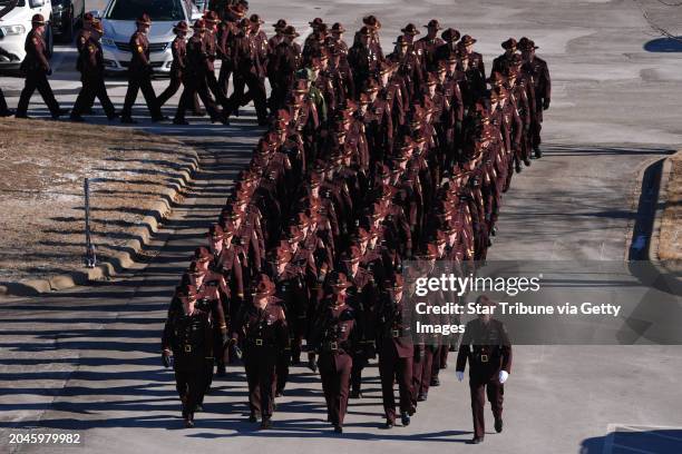 Law enforcement members arrive before the start of a memorial service for Burnsville, Minn. Police officers Paul Elmstrand Matthew Ruge and...