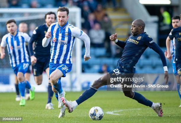 Kilmarnock's Marley Watkins and Dundee's Mo Sylla in action during a cinch Premiership match between Dundee and Kilmarnock at the Scot Foam Stadium...