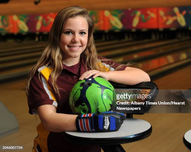 Bishop Gibbons bowler Janielle Irwin poses with her bowling ball at Sportsmans Bowl on Thursday, Jan. 23, 2014 in Schenectady, N.Y.
