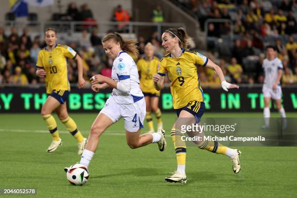 Gloria Sliskovic of Bosnia and Herzegovina and Kosovare Asllani of Sweden battle for possession during the UEFA Women's Nations League Promotion &...