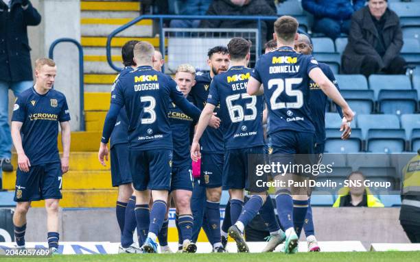 Dundee's Luke McCowan celebrates scoring a penalty to make it 2-1 with teammates during a cinch Premiership match between Dundee and Kilmarnock at...