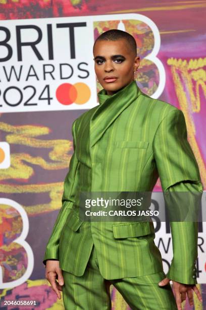 Red carpet host Layton Williams poses on the red carpet upon arrival for the BRIT Awards 2024 in London on March 2, 2024. / RESTRICTED TO EDITORIAL...