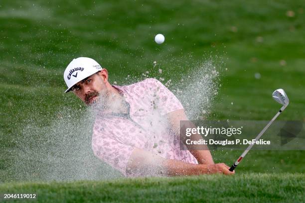 Erik van Rooyen of South Africa hits from the 10th bunker prior to The Cognizant Classic in The Palm Beaches at PGA National Resort And Spa on...