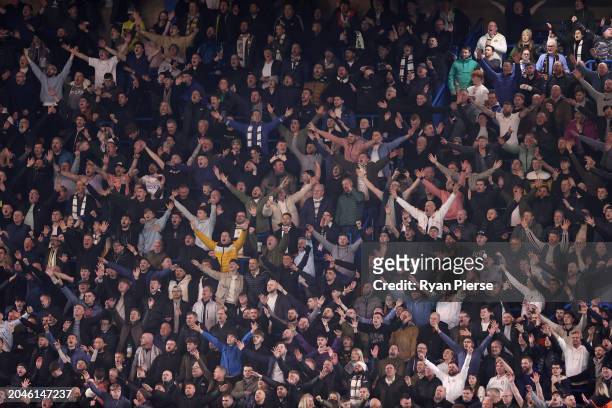Leeds United fans celebrate during the Emirates FA Cup Fifth Round match between Chelsea and Leeds United at Stamford Bridge on February 28, 2024 in...