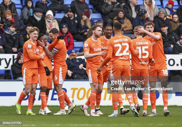 Blackpool's Karamoko Dembele celebrates scoring the opening goal with Oliver Norburn and George Byers during the Sky Bet League One match between...