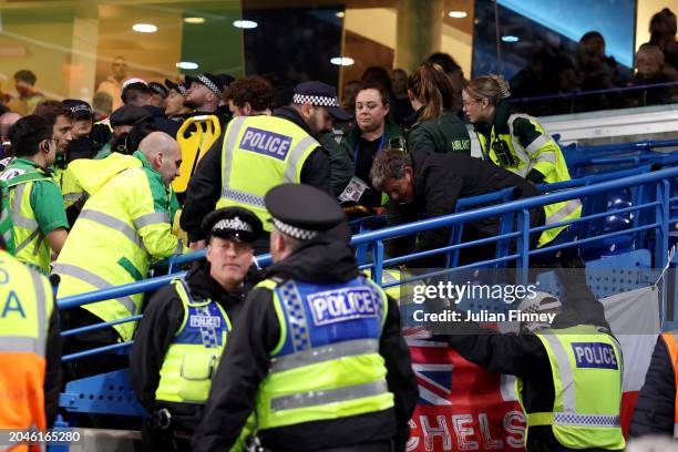 Fan receives treatment in the stand during the Emirates FA Cup Fifth Round match between Chelsea and Leeds United at Stamford Bridge on February 28,...
