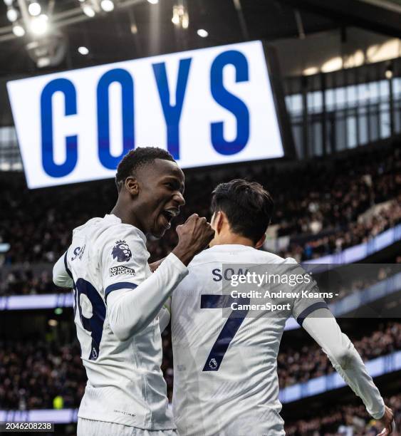 Tottenham Hotspur's Son Heung-Min celebrates scoring his side's third goal with team mate Pape Matar Sarr during the Premier League match between...