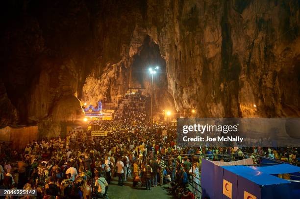 People gather in a cave in Kuala Lumpur, Malaysia, in February 2010, during Thaipusam, a major religious festival celebrated by the Hindu Tamil...