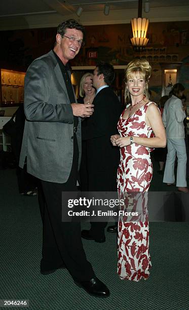 Creator of TV show 'ER' and author Michael Crichton with actress Traci Lords at the HarperCollins Book party celebrating the end of the publishing...