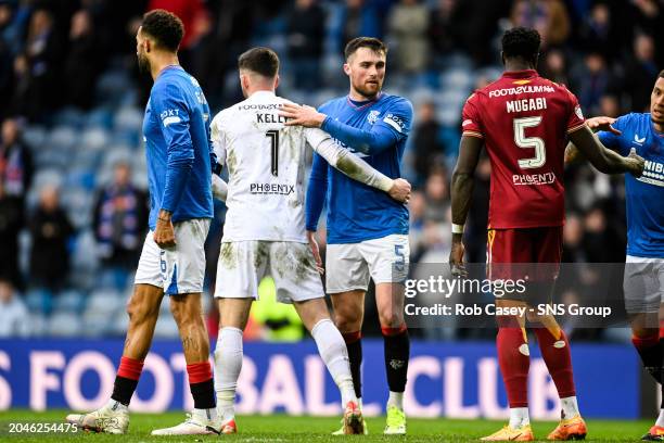 Rangers' John Souttar and Motherwell's Liam Kelly at full time during a cinch Premiership match between Rangers and Motherwell at Ibrox Stadium, on...