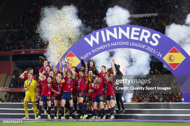 Captain Irene Paredes of Spain lifts the UEFA Women's Nations League trophy as the Spain team celebrate victory following during the UEFA Women's...