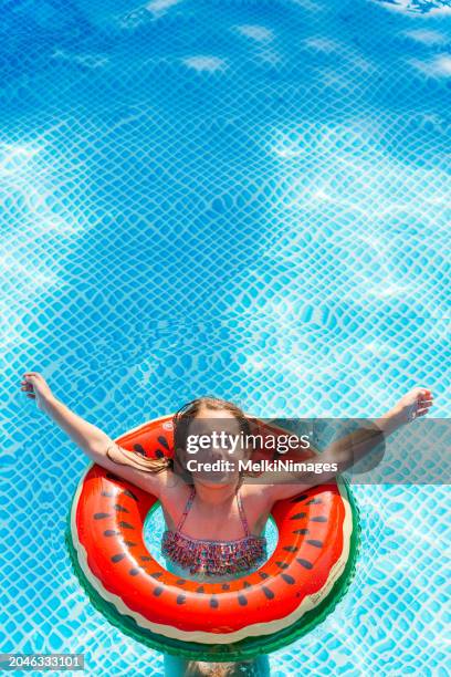 summer enjoyment in the pool - inflatable swimming pool stock pictures, royalty-free photos & images