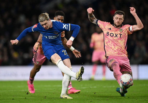 Conor Gallagher of Chelsea scores his team's third goal whilst under pressure from Liam Cooper of Leeds United during the Emirates FA Cup Fifth Round...
