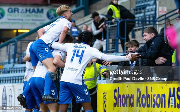 Kilmarnock players celebrate in front of fans after Robbie Deas scores to make it 2-2 during a cinch Premiership match between Dundee and Kilmarnock...