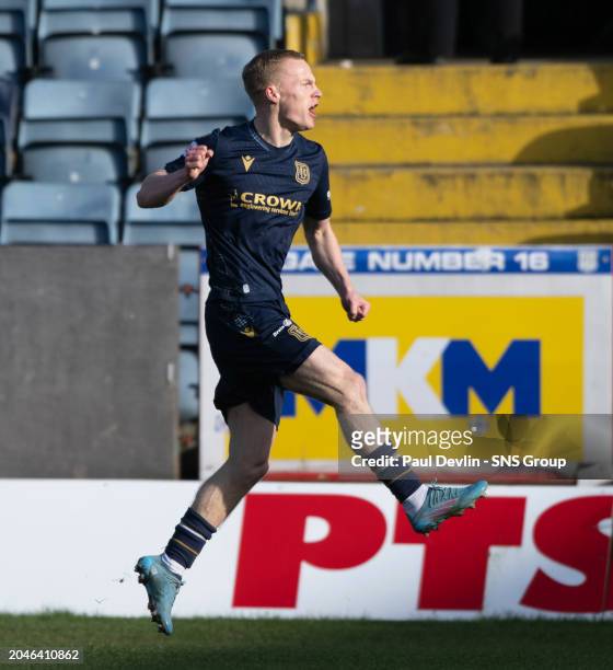 Dundee's Scott Tiffoney celebrates after his shot hits the post and is deflected off Kilmarnock's Will Dennis into the back of the net to make it 1-0...
