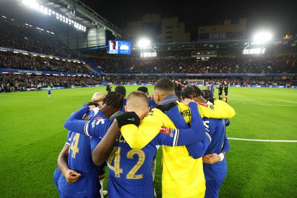 Players of Chelsea form a huddle on the pitch prior to the Emirates FA Cup Fifth Round match between Chelsea and Leeds United at Stamford Bridge on...