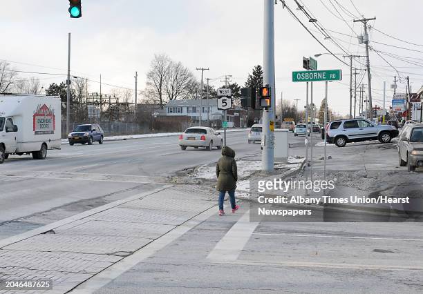 Woman crosses the intersection of Central Ave. And Osborne Rd. On Wednesday, Jan. 7, 2015 in Colonie, N.Y. This intersection has had one of the...