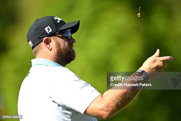 Aaron Pike of Australia throws some grass during day one of the 2024 New Zealand Golf Open at Millbrook Resort on February 29, 2024 in Queenstown,...