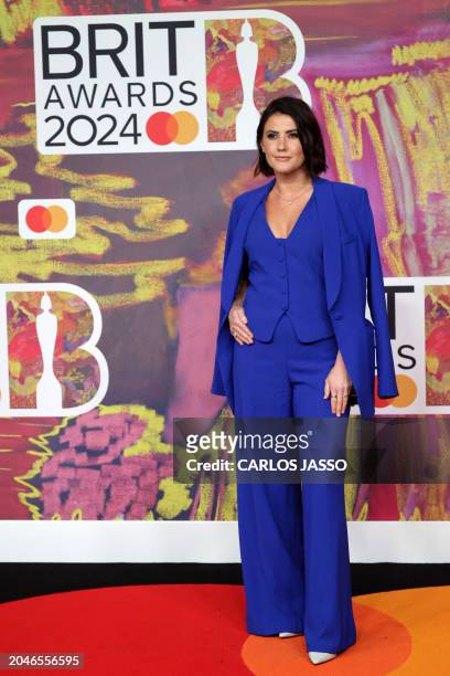 British radio DJ Aimee Vivian poses on the red carpet upon arrival for the BRIT Awards 2024 in London on March 2, 2024. / RESTRICTED TO EDITORIAL USE...