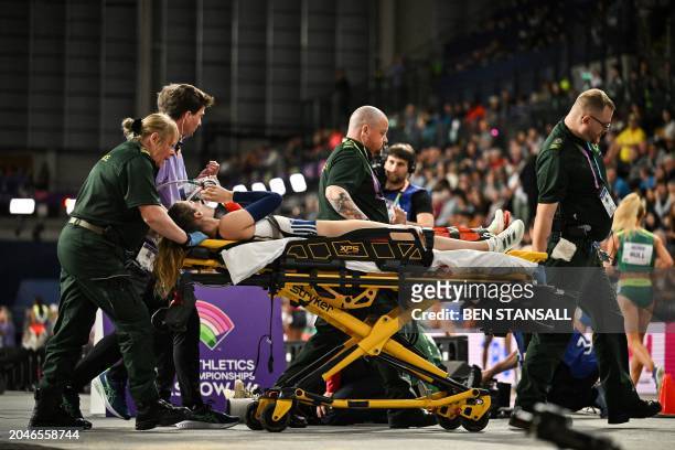 France's Margot Chevrier is evacuated on a stretcher after falling while competing in the Women's Pole Vault final during the Indoor World Athletics...