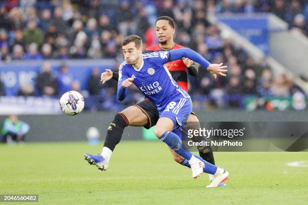 Harry Winks of Leicester City is being challenged by Chris Willock of Queens Park Rangers during the second half of the Sky Bet Championship match at...