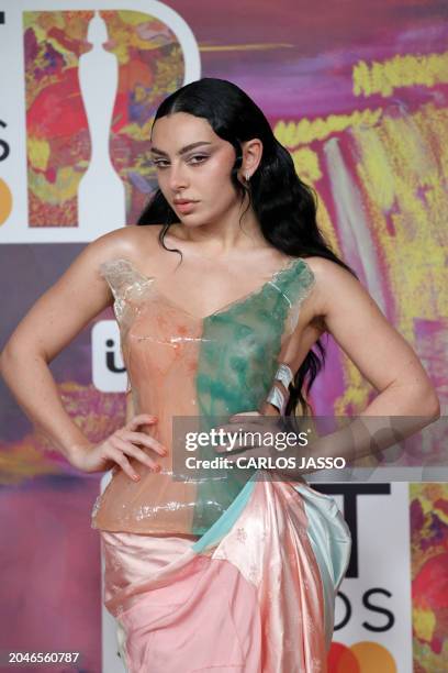 British singer-songwriter Charli XCX poses on the red carpet upon arrival for the BRIT Awards 2024 in London on March 2, 2024. / RESTRICTED TO...