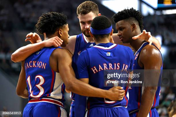 The Kansas Jayhawks huddle up before a free throw as Kansas takes on the Baylor Bears in the second half at Foster Pavilion on March 2, 2024 in Waco,...