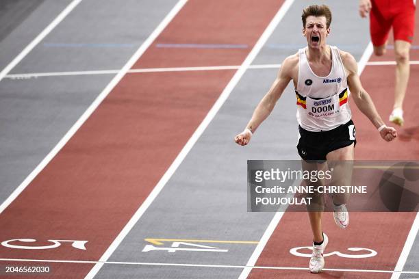 First-placed Belgium's Alexander Doom celebrates as he crosses the finish line to win the Men's 400m final during the Indoor World Athletics...
