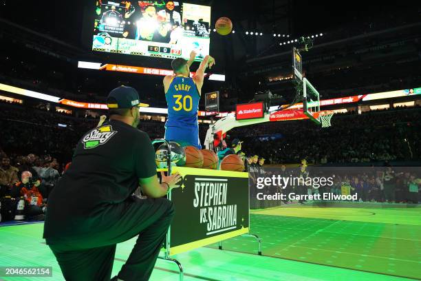 Stephen Curry of the Golden State Warriors shoots a three point basket during the Stephen vs Sabrina 3 Point Contest as a part of State Farm All-Star...