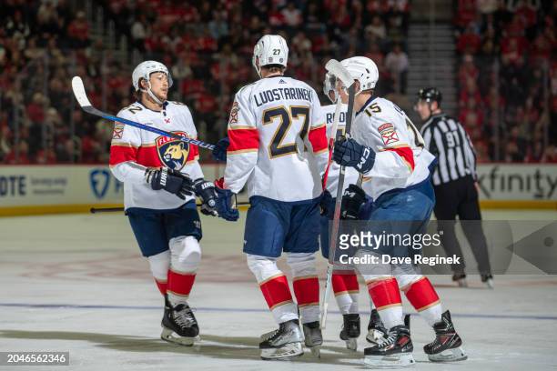 Brandon Montour of the Florida Panthers celebrates his goal with teammates during the second period against the Detroit Red Wings at Little Caesars...