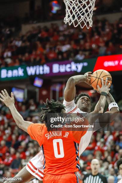 Wisconsin guard AJ Storr is fouled by Illinois guard Terrence Shannon Jr. During a college basketball game between the University of Wisconsin...