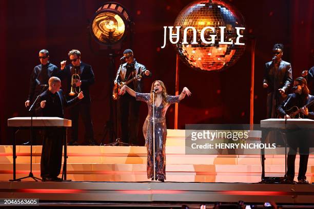 Lydia Kitto, Tom McFarland and Josh Lloyd-Watson from British electronic music project Jungle perform on stage during the BRIT Awards 2024 ceremony...