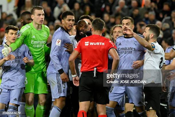 Spanish referee Jesus Gil Manzano talks with Real Madrid's players during the Spanish league football match between Valencia CF and Real Madrid at...